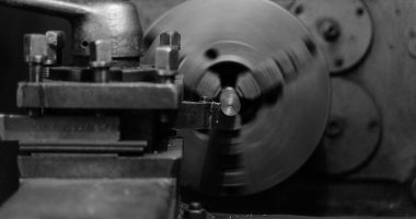 Grayscale Photo of a Lathe Machine