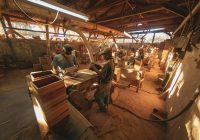 people sitting on chair inside wood working