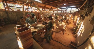people sitting on chair inside wood working